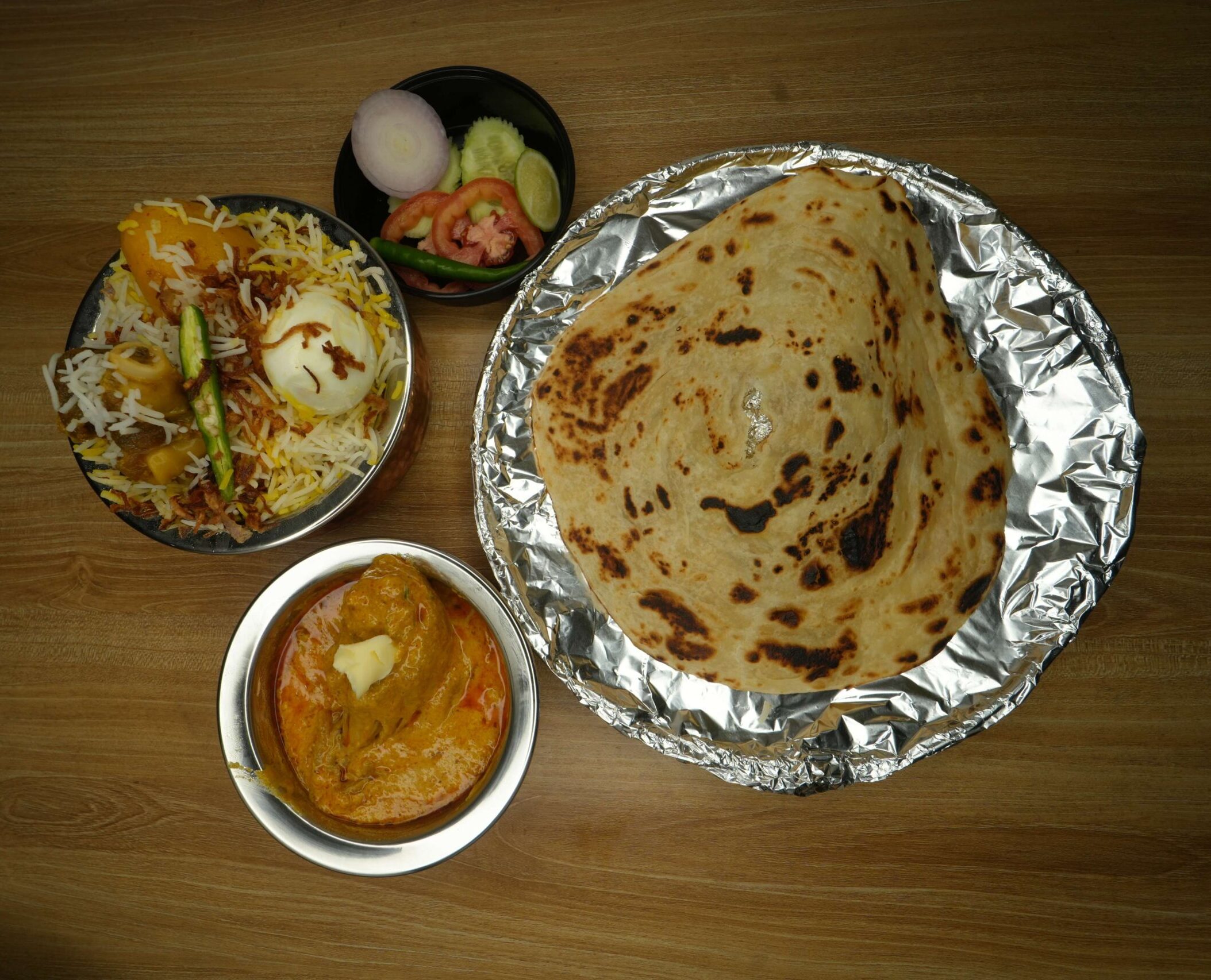 Mutton biryani+Butter Chicken+Lacha Paratha+green salad5 (1)