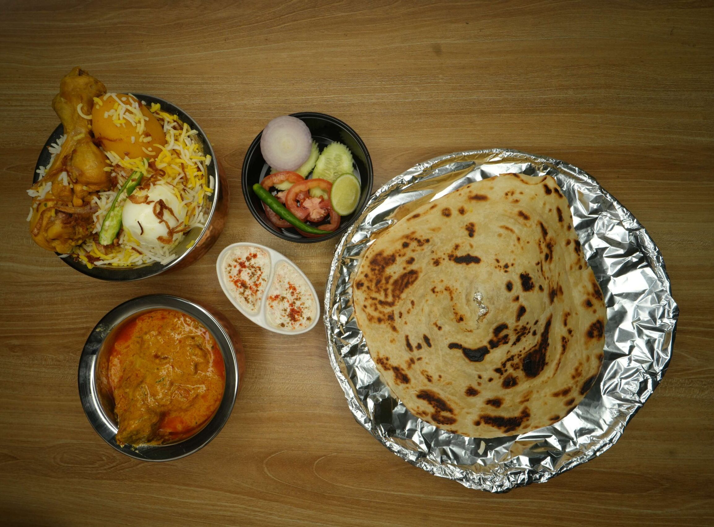 chicken biryani+mutton handi+lacha paratha+green salad+raita2 (1)